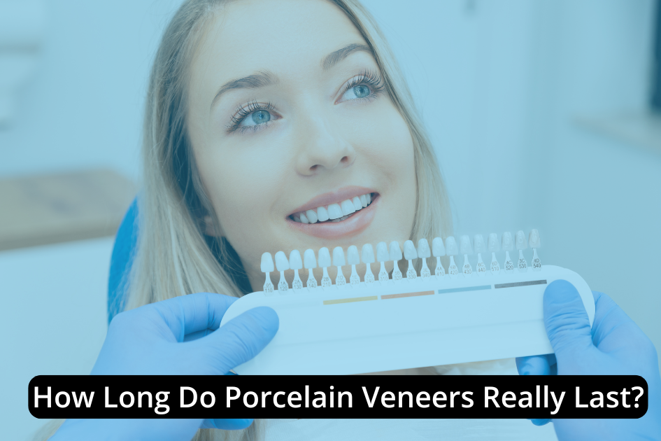 A dentist holds a shade guide to a smiling woman's teeth in a dental office, with text asking about the lifespan of dental veneers.
